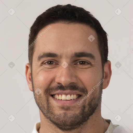 Joyful white adult male with short  brown hair and brown eyes