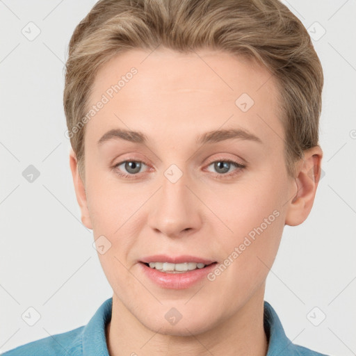 Joyful white young-adult female with short  brown hair and grey eyes