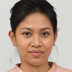 Joyful asian young-adult female with medium  brown hair and brown eyes