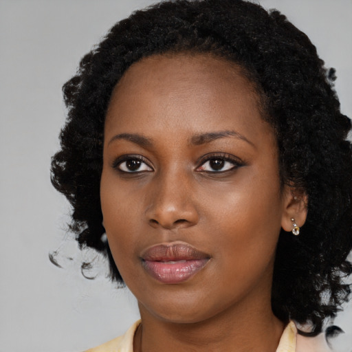 Neutral black young-adult female with long  black hair and brown eyes