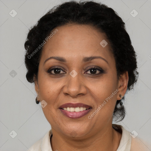 Joyful latino adult female with short  brown hair and brown eyes