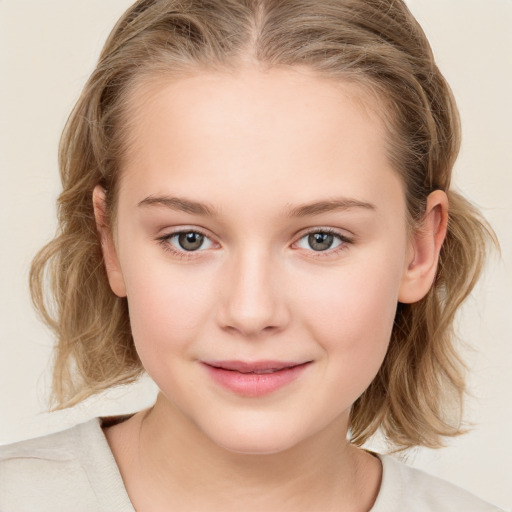 Joyful white child female with medium  brown hair and blue eyes