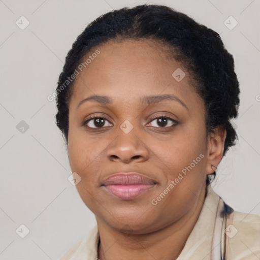 Joyful black young-adult female with short  brown hair and brown eyes