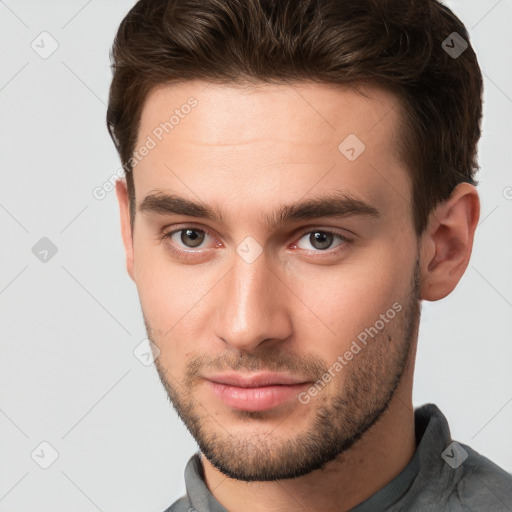 Neutral white young-adult male with short  brown hair and grey eyes