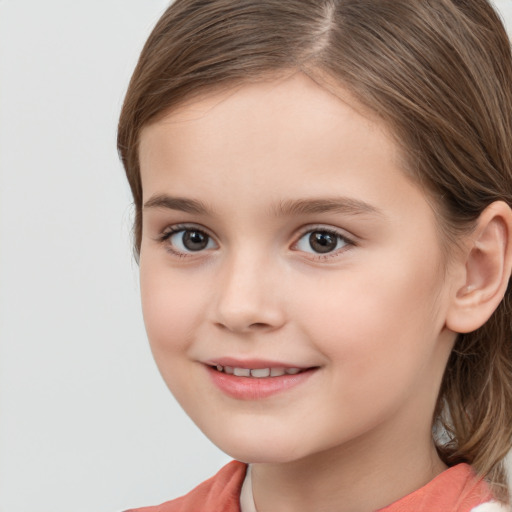 Joyful white child female with medium  brown hair and brown eyes