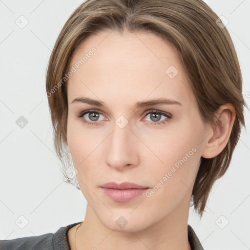 Neutral white young-adult female with medium  brown hair and grey eyes