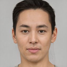 Joyful asian young-adult male with short  brown hair and brown eyes