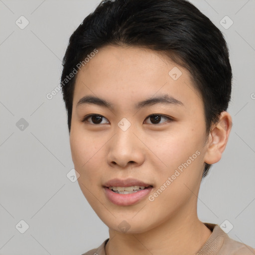 Joyful asian young-adult female with short  black hair and brown eyes