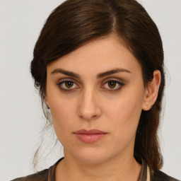 Neutral white young-adult female with medium  brown hair and brown eyes