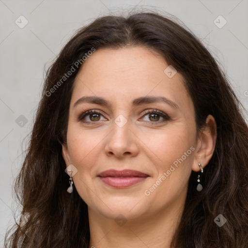 Joyful white adult female with long  brown hair and brown eyes