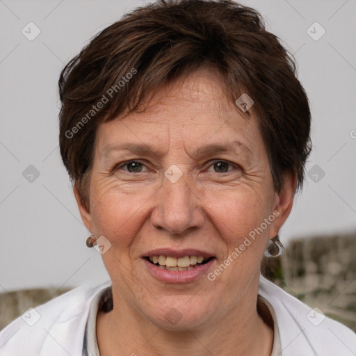 Joyful white adult female with short  brown hair and brown eyes