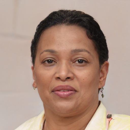 Joyful latino adult female with short  brown hair and brown eyes
