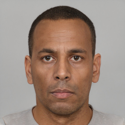 Neutral black adult male with short  brown hair and brown eyes