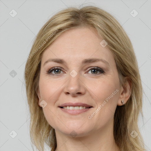 Joyful white young-adult female with medium  brown hair and grey eyes