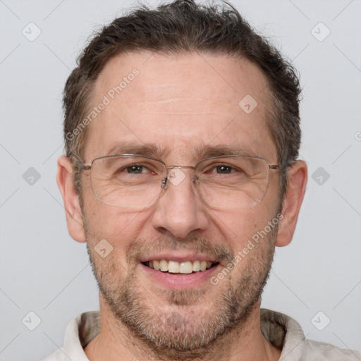 Joyful white adult male with short  brown hair and grey eyes