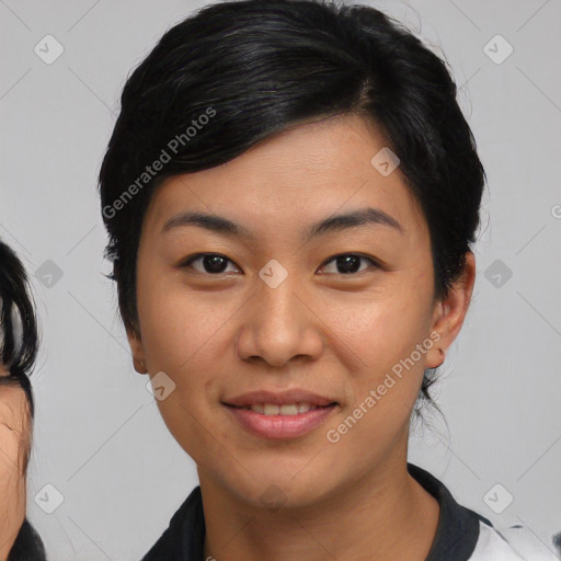 Joyful asian young-adult female with medium  black hair and brown eyes