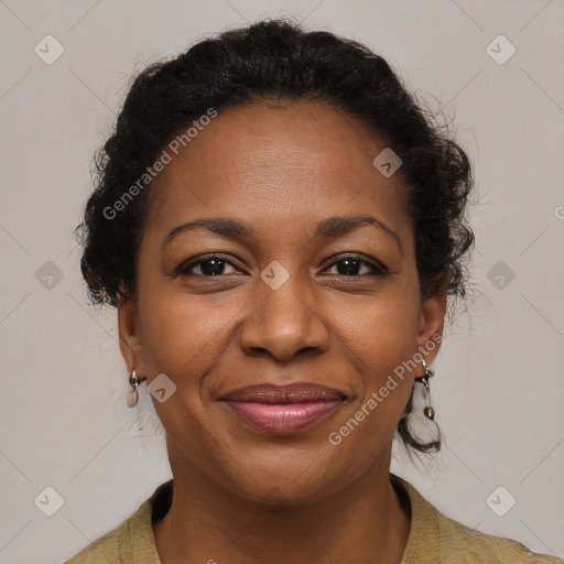 Joyful black adult female with medium  brown hair and brown eyes