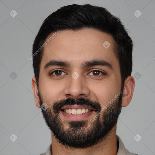 Joyful latino young-adult male with short  black hair and brown eyes