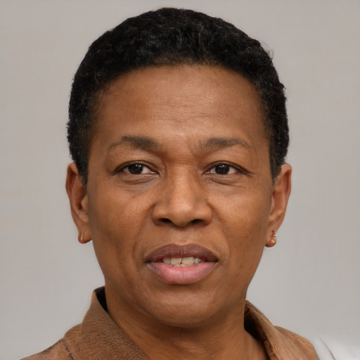 Joyful black adult male with short  black hair and brown eyes