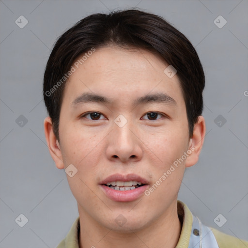 Joyful asian young-adult male with short  brown hair and brown eyes