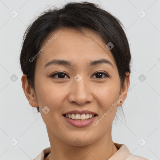 Joyful asian young-adult female with short  brown hair and brown eyes