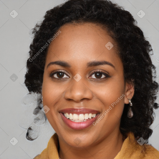 Joyful black young-adult female with long  black hair and brown eyes