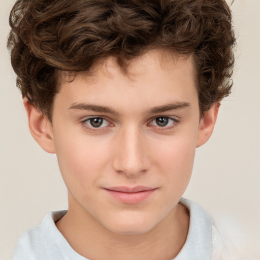 Joyful white child male with short  brown hair and brown eyes