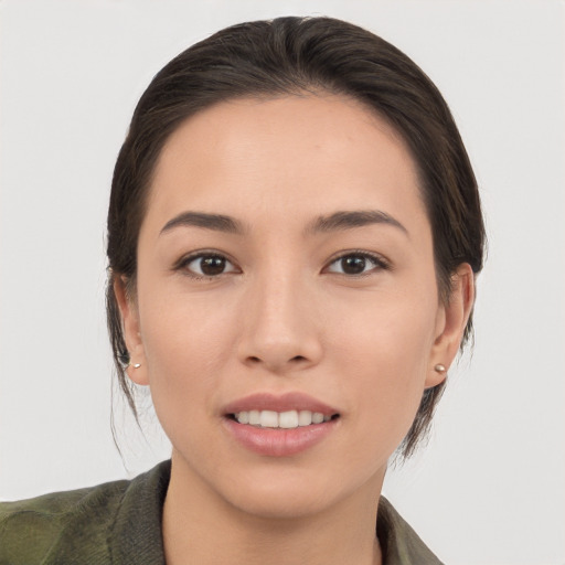 Joyful white young-adult female with medium  brown hair and brown eyes