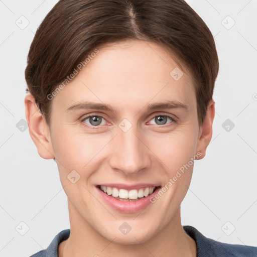 Joyful white young-adult female with short  brown hair and grey eyes