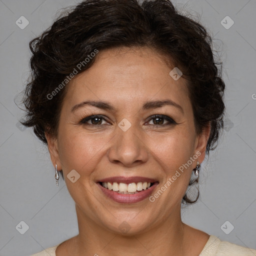 Joyful white adult female with short  brown hair and brown eyes