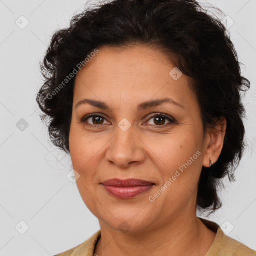 Joyful latino adult female with medium  brown hair and brown eyes