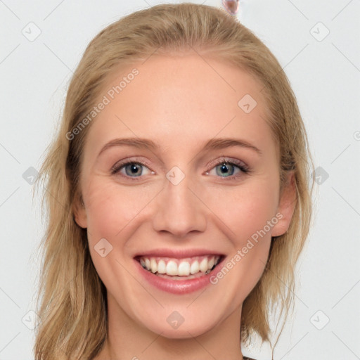 Joyful white young-adult female with medium  brown hair and blue eyes