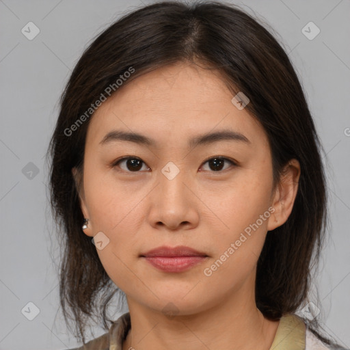 Joyful asian young-adult female with medium  brown hair and brown eyes