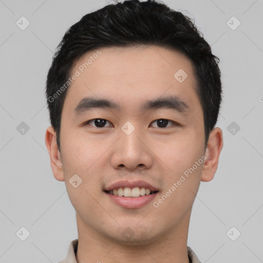 Joyful asian young-adult male with short  black hair and brown eyes