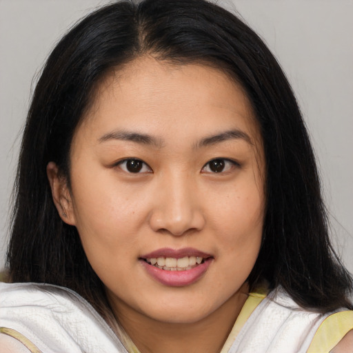 Joyful asian young-adult female with medium  brown hair and brown eyes