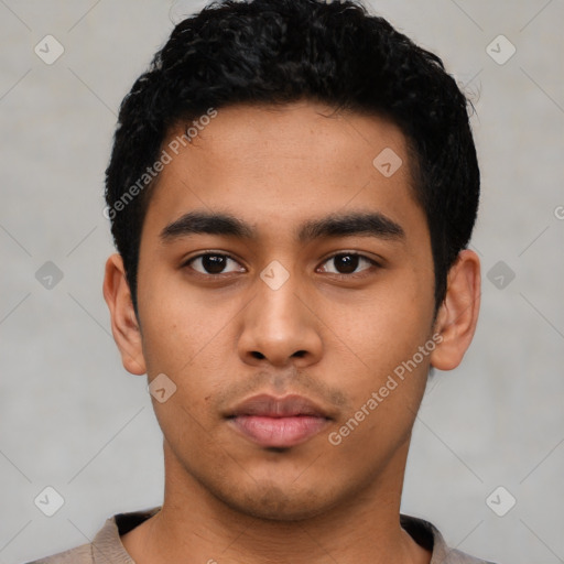 Neutral latino young-adult male with short  black hair and brown eyes