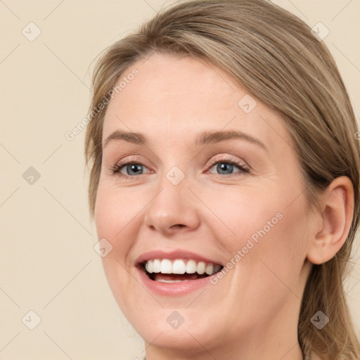 Joyful white young-adult female with medium  brown hair and green eyes