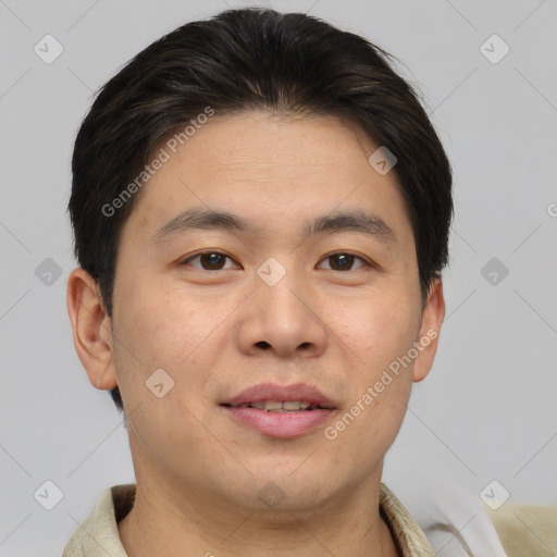 Joyful asian young-adult male with short  brown hair and brown eyes