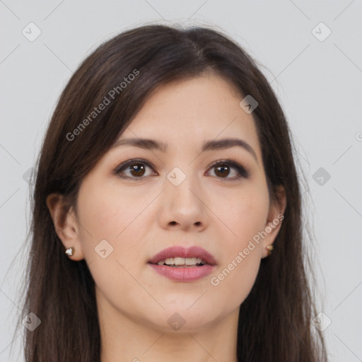 Joyful asian young-adult female with long  brown hair and brown eyes