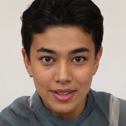 Joyful latino young-adult male with short  brown hair and brown eyes