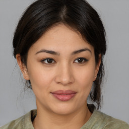 Joyful asian young-adult female with medium  brown hair and brown eyes