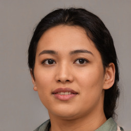 Joyful asian young-adult female with medium  brown hair and brown eyes