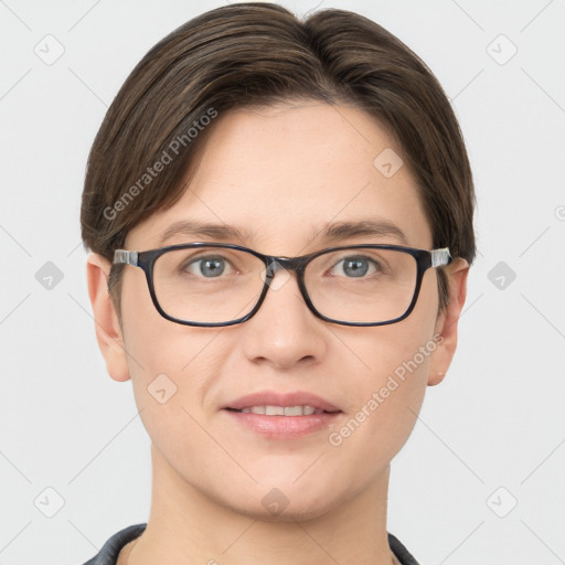 Joyful white young-adult female with short  brown hair and grey eyes