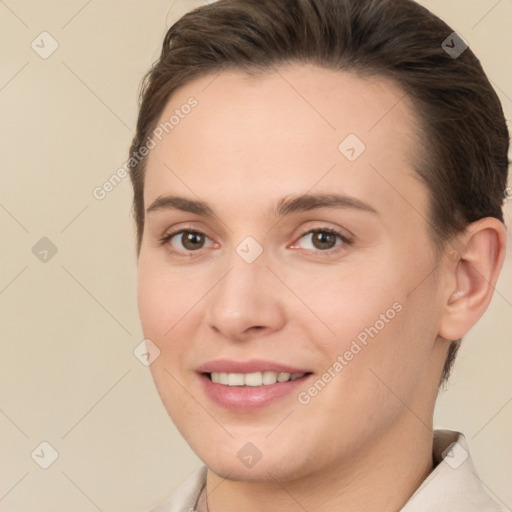 Joyful white young-adult female with short  brown hair and brown eyes