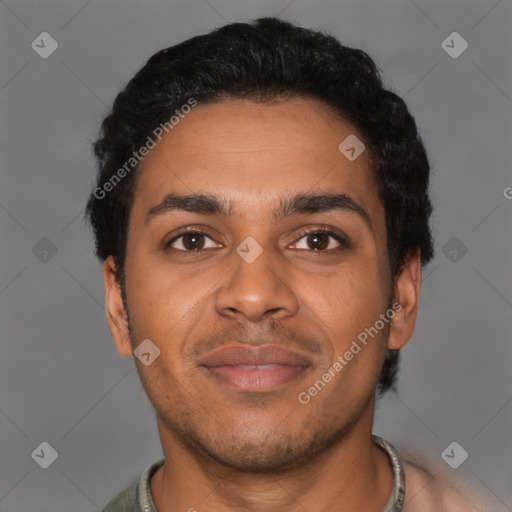 Joyful black young-adult male with short  brown hair and brown eyes