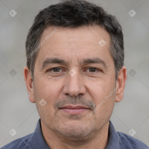 Joyful white adult male with short  brown hair and brown eyes