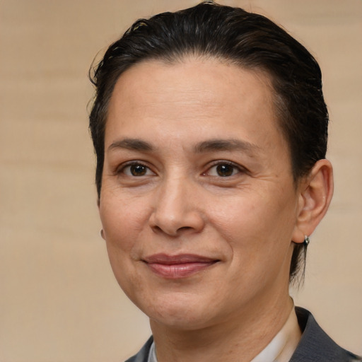 Joyful white adult female with short  brown hair and brown eyes