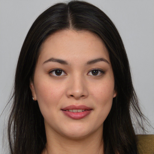 Joyful white young-adult female with long  black hair and brown eyes