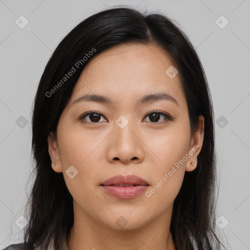 Joyful asian young-adult female with long  brown hair and brown eyes