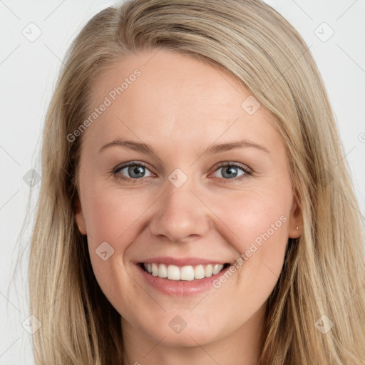 Joyful white young-adult female with long  brown hair and blue eyes